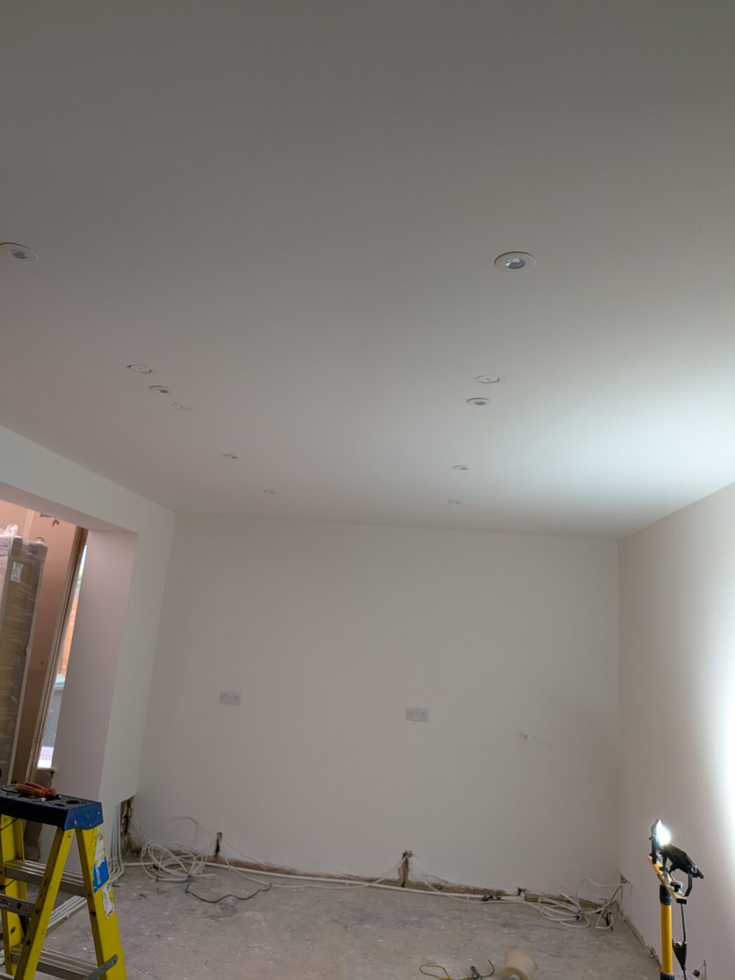 Recessed LED ceiling downlights installed in a room